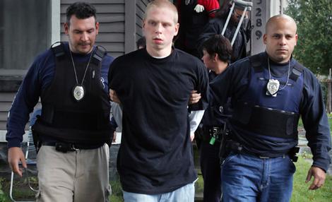 Stephen Coon, the brother of school shooter Asa Coon,  is taken into custody.
